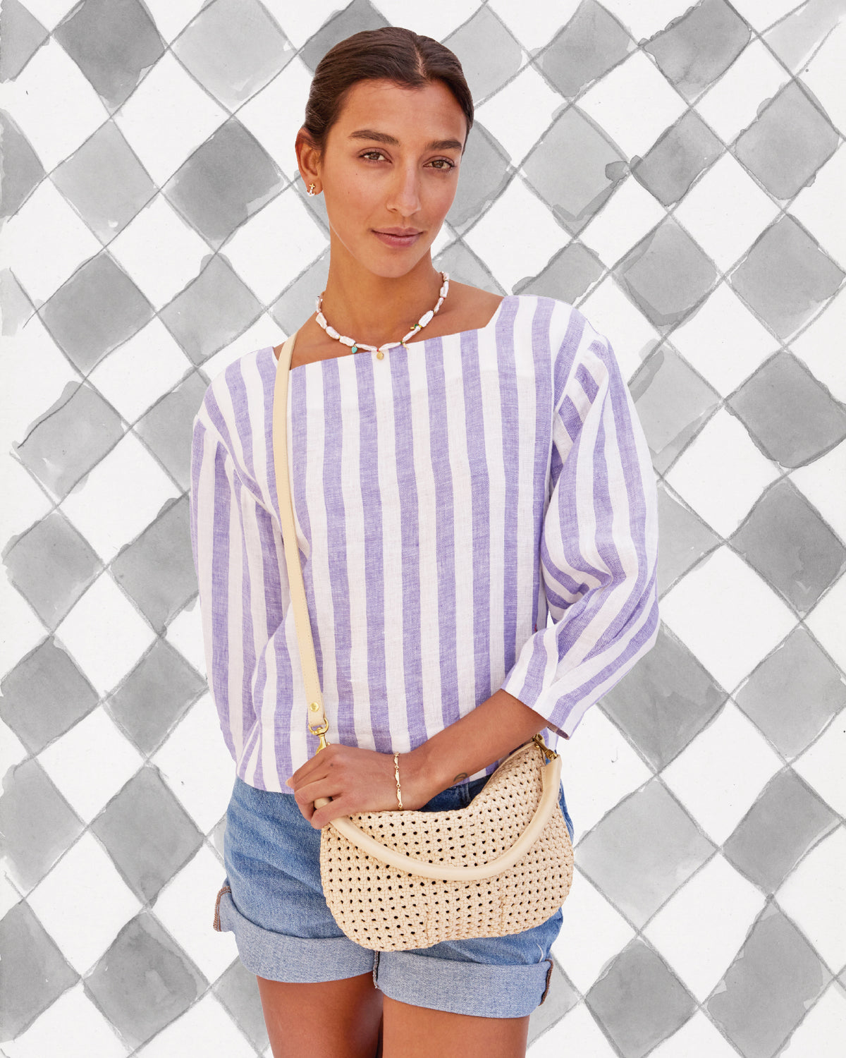 Model carrying the Cream Rattan Petit Moyen.