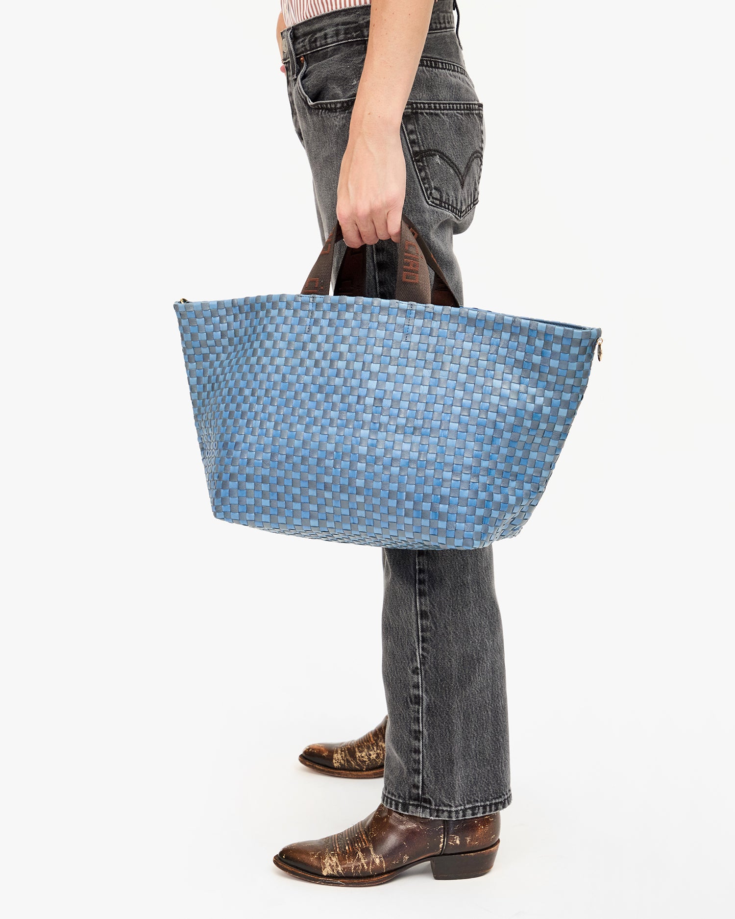 Danica holds the Bateau Tote by the Top Handle