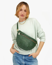 Zoe wearing the Evergreen Woven Zig-Zag Grande Fanny across her chest