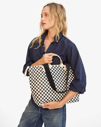 Mae holding the Black & Cream Checkers Le Zip Sac