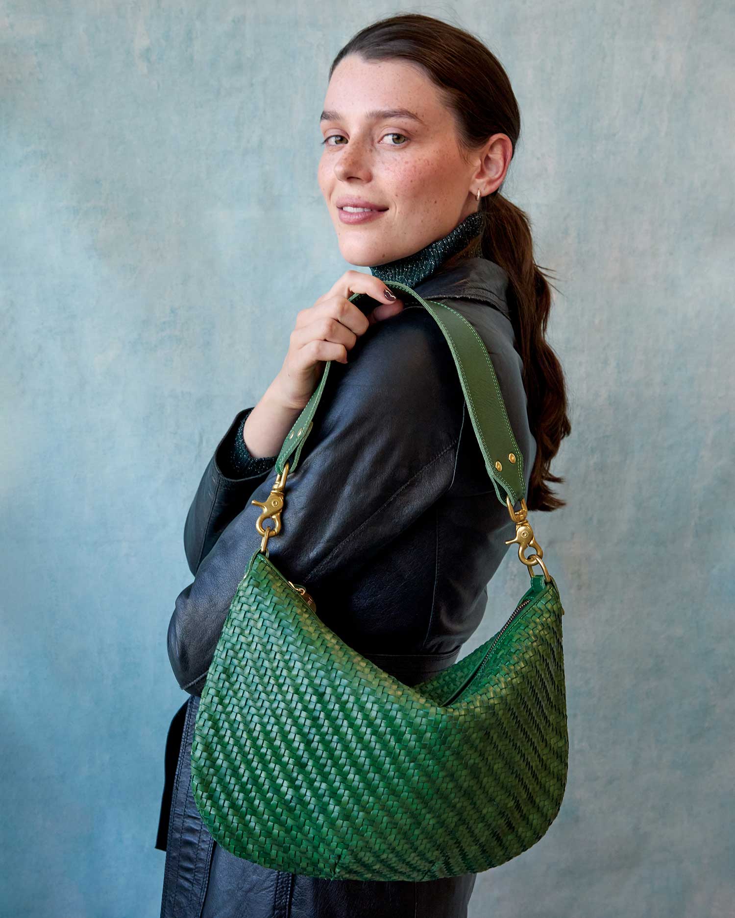 Lore Wearing the Evergreen Woven Zig-Zag Moyen Messenger as a Shoulder Bag