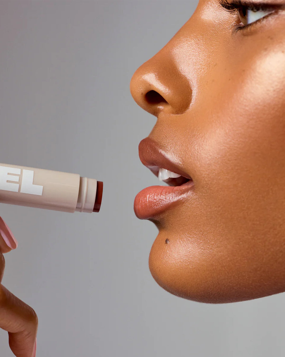 Model Wears Rel Lip Balm in Absolutely