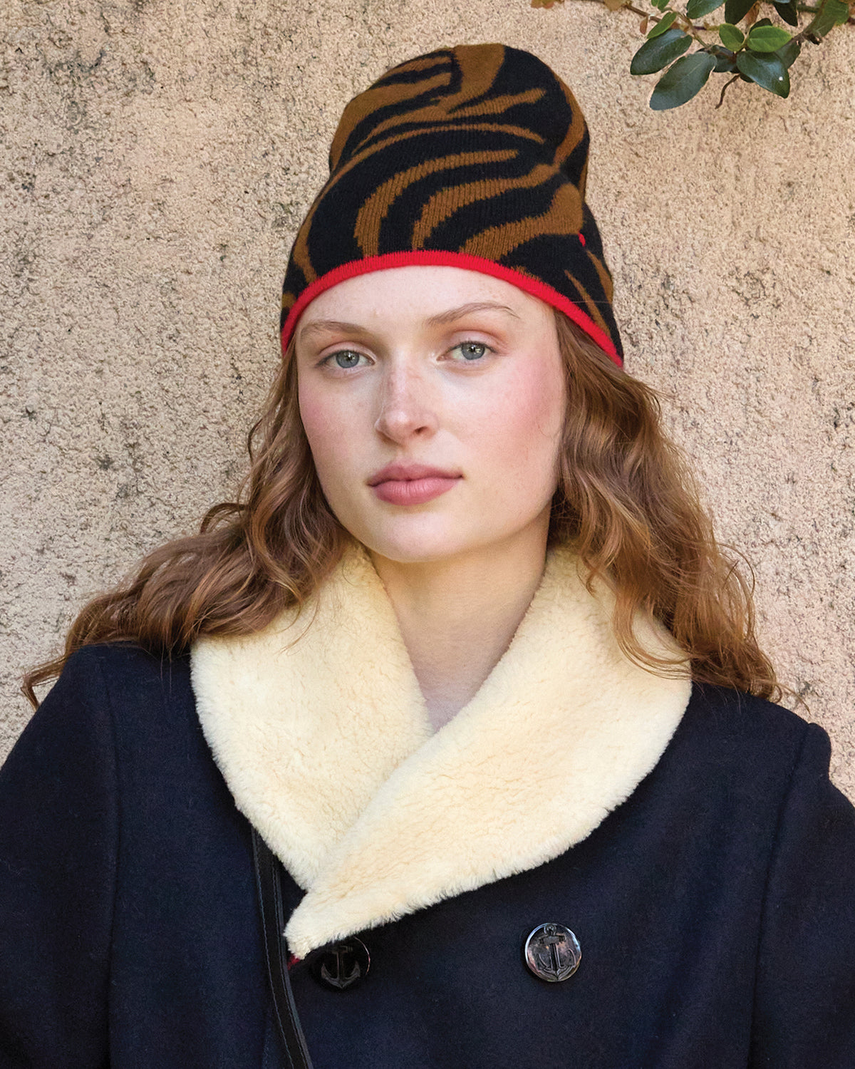 Model wearing the Brown and Black Zebra Beanie. 