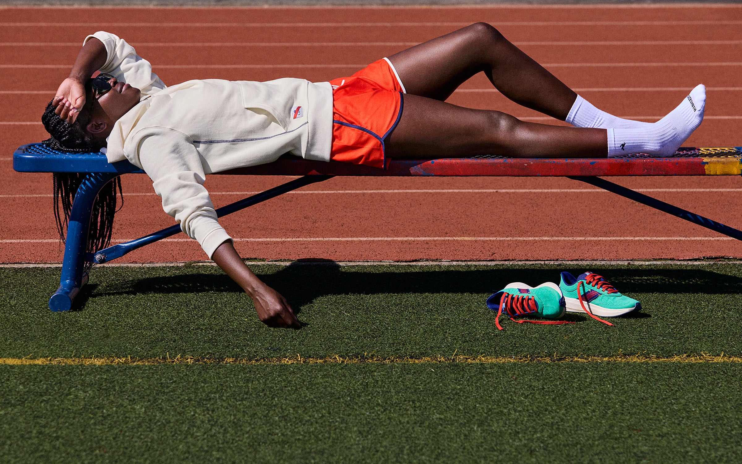 Model wearing the CV x Tracksmith collection.