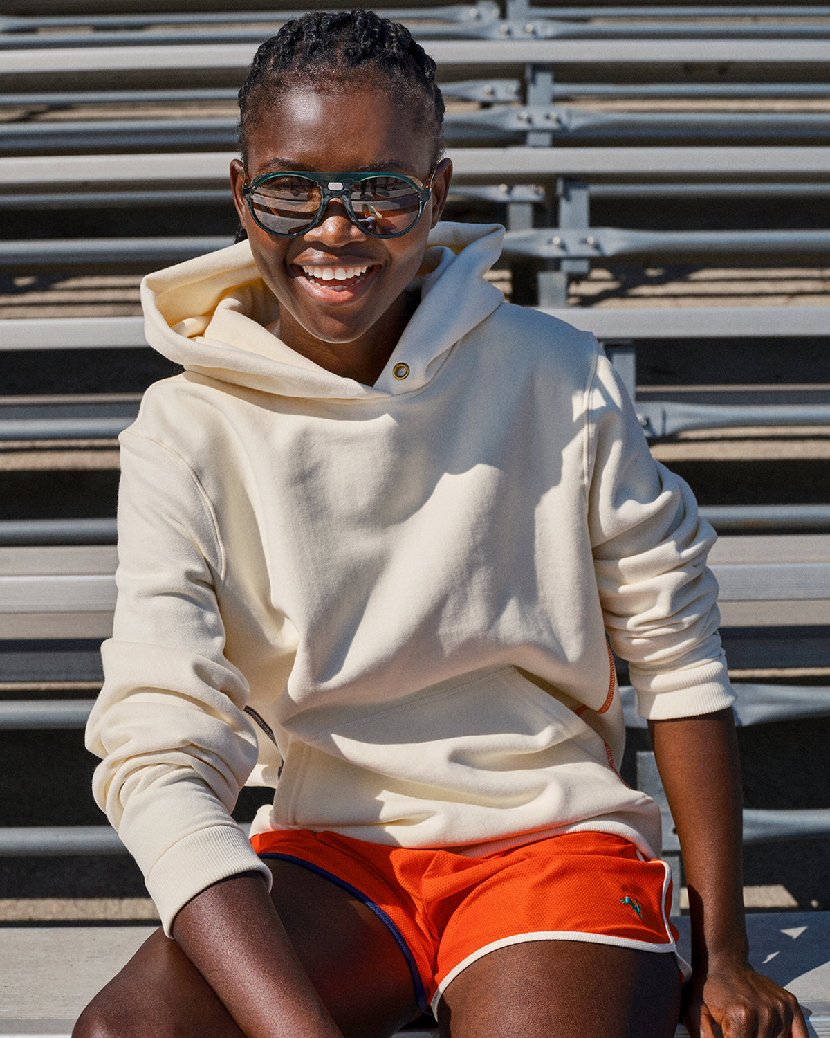 Model wearing the CV x Tracksmith Sweatshirt and Shorts.