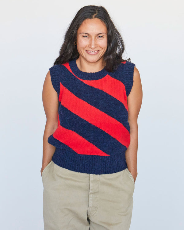 Andrea wearing the Navy & Poppy Diagonal Stripe Franc Vest with khakis