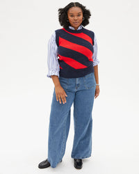 Candace wearing wide leg jeans and the Navy & Poppy Diagonal Stripe Franc Vest over a striped button up